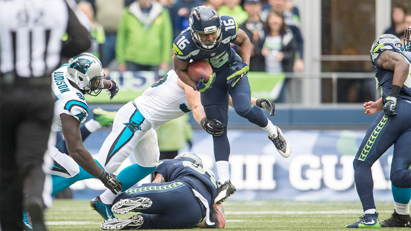 Seattle Seahawks wide receiver Tyler Lockett tries to slip a tackle during the 2015 regular season Seattle-Carolina matchup, which the Panthers won 27-23. (Photo: Rod Mar/Seattle Seahawks)